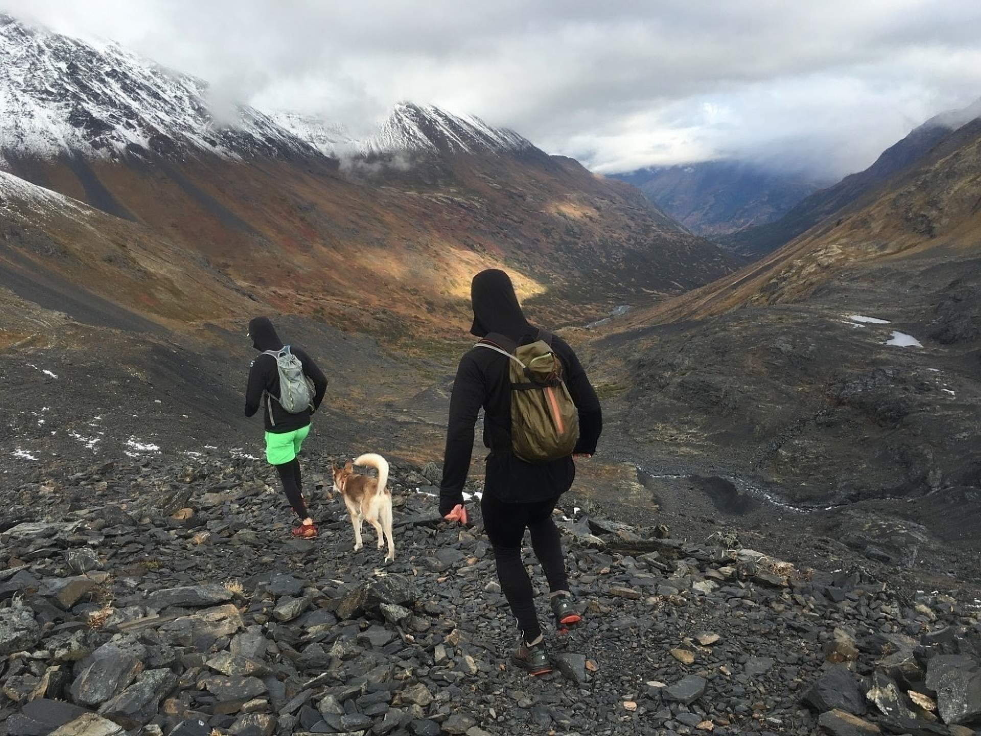 Hikers descend Crow Pass towards Eagle River