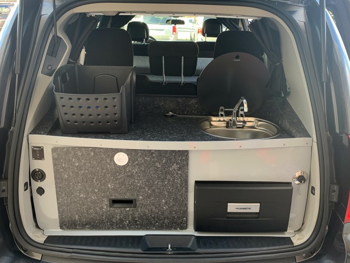 Kitchenette in the rear of a rental camper van.
