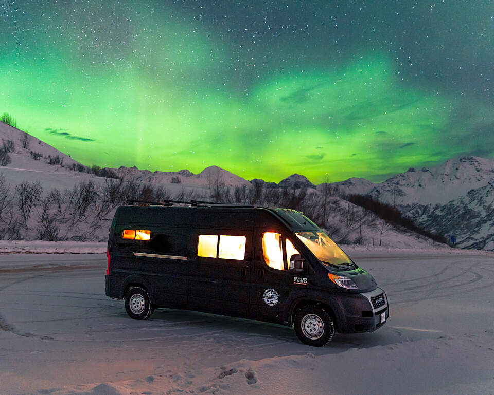 River Wild Campervan with a backdrop of the northern lights